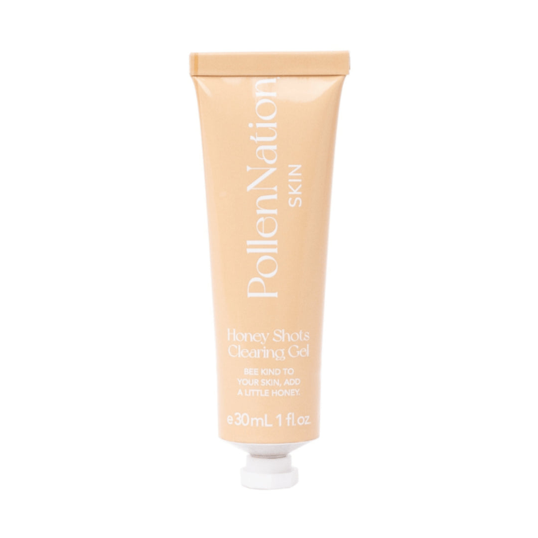 A tube of PollenNation Skin Honey Shots Clearing Gel. The tube is beige with white text that includes the brand name, product description, and the slogan 'Bee kind to your skin, add a little honey.' It contains 30 mL or 1 fl oz of product designed for sensitive skin.