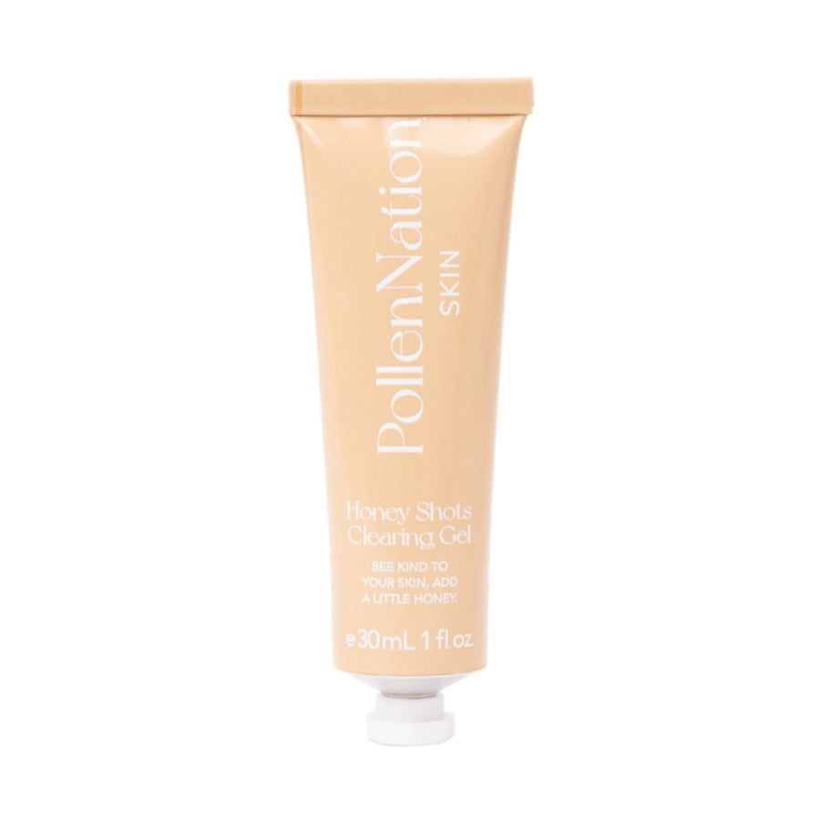 A tube of PollenNation Skin Honey Shots Clearing Gel. The tube is beige with white text that includes the brand name, product description, and the slogan 'Bee kind to your skin, add a little honey.' It contains 30 mL or 1 fl oz of product designed for sensitive skin.