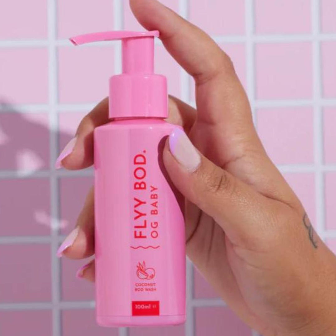 Vibrant pink pump bottle of FLYY BODY OG BABY Coconut Body Wash, 100ml, from an Australian natural body care line, perfect for skin hydration and skin nourishment, and the allure of exotic coconut-infused skincare.
