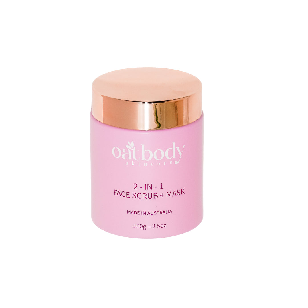 Jar of Oatbody Skincare, 2-in-1 Face Scrub and Mask, 100g. Soft pink container with shiny gold cap, labeled with product name, weight, and origin.