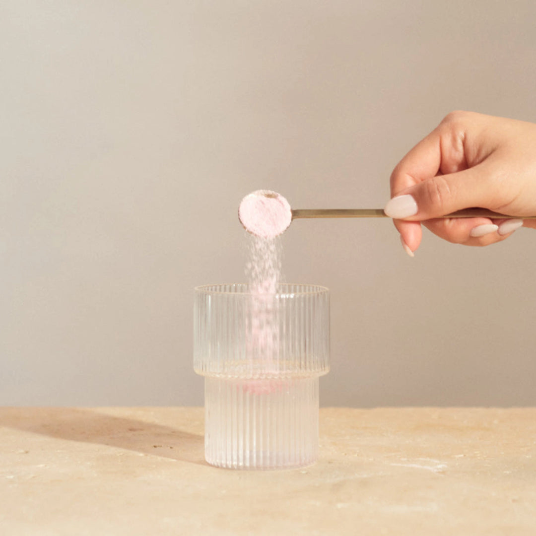 best collagen supplement being poured in a glass cup for glowing skin from Innour, shop at VAMS Beauty.