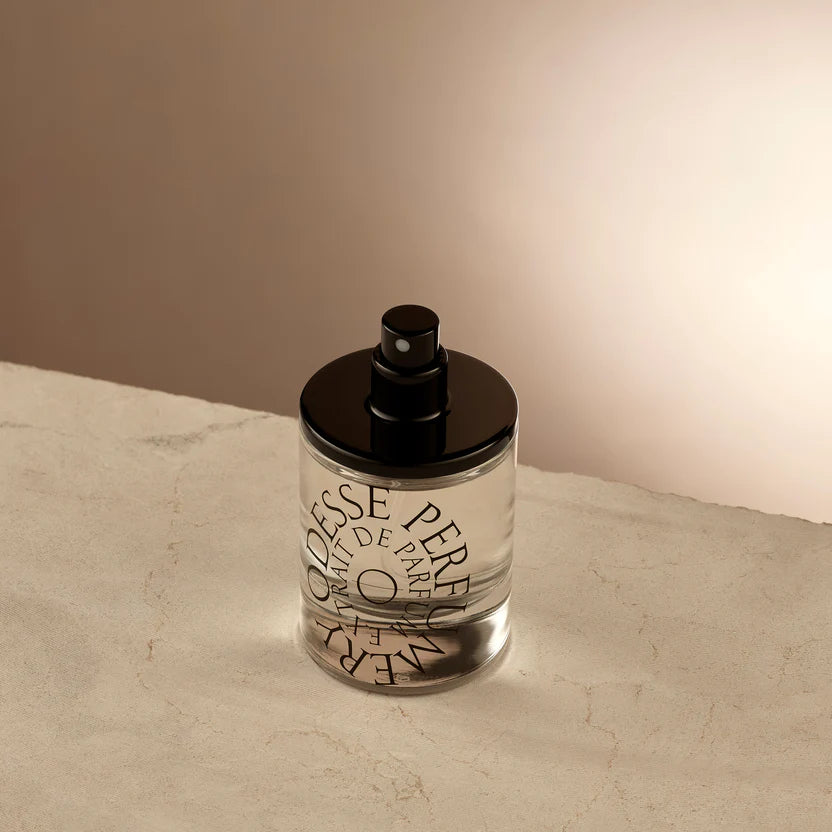 Minimalist Odesse perfume bottle on a soft-lit surface, evoking a sense of modern luxury for Australian fragrance lovers..