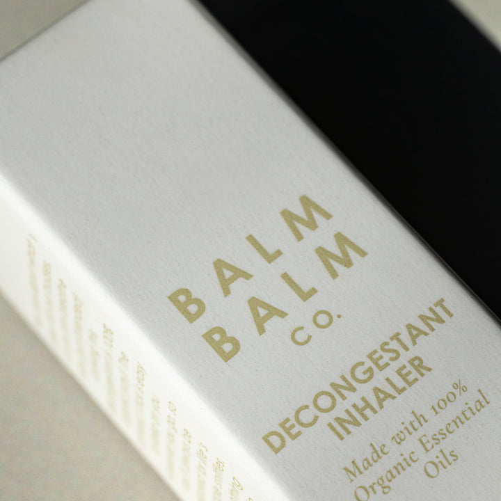 Close-up of Balm Balm Co. decongestant inhaler packaging, highlighting organic essential oils, aimed at consumers seeking natural health remedies in Australia.