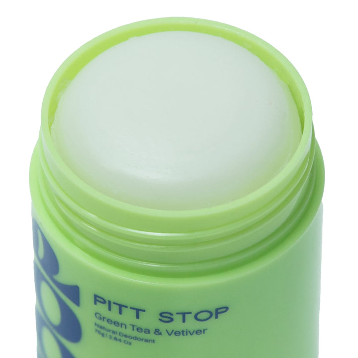 Green container of Pitt Stop best natural deodorant for women in a green roll on from Skoop Skincare with a white cap on a white background
