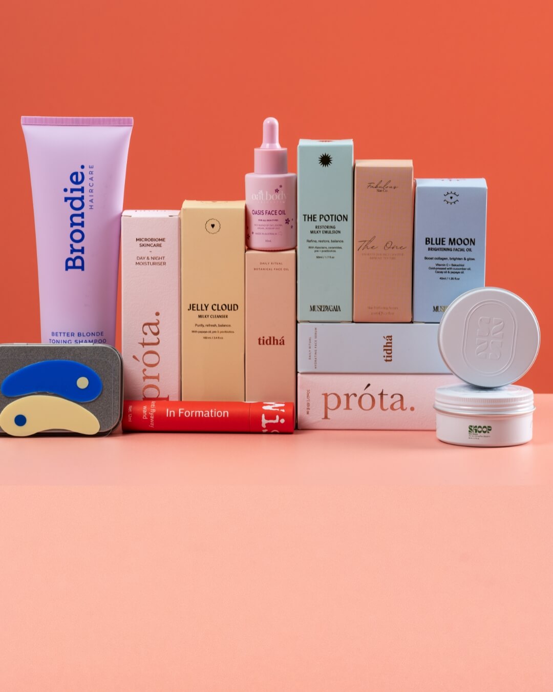 Collection of Australian skincare products and cosmetic products on a peach background