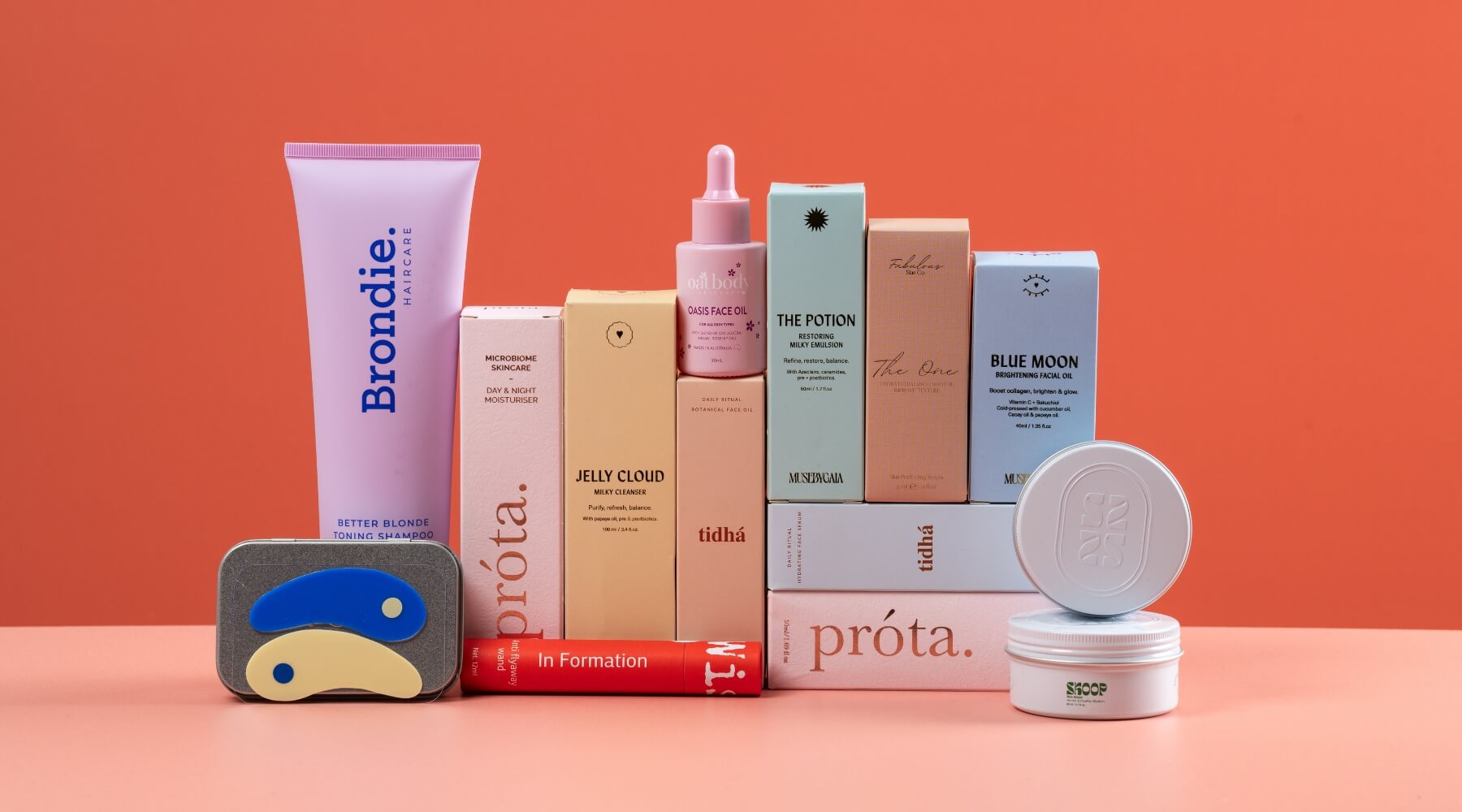 collection of Australian skincare products against an orange background. Natural skin care shop from VAMS Beauty.