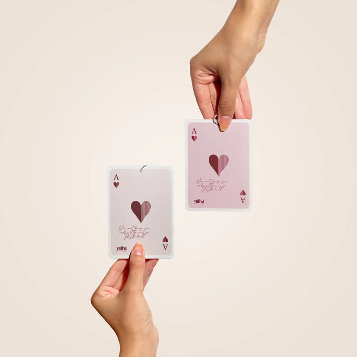 Luxury car hanging perfume card, inspired by high-end perfume blends being held in hands.
