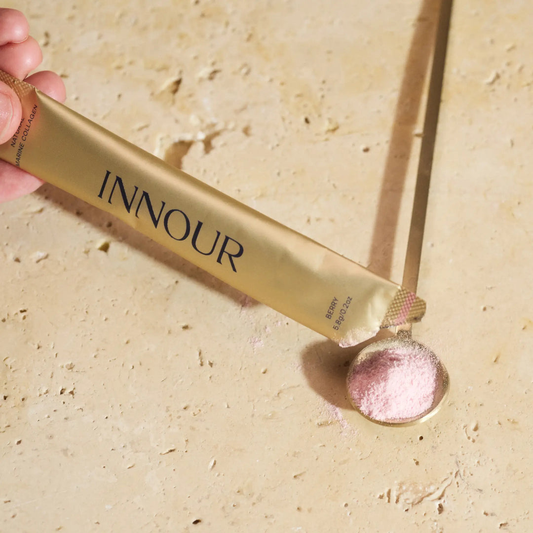 INNOUR natural marine collagen powder with a pinkish powder on a beige background