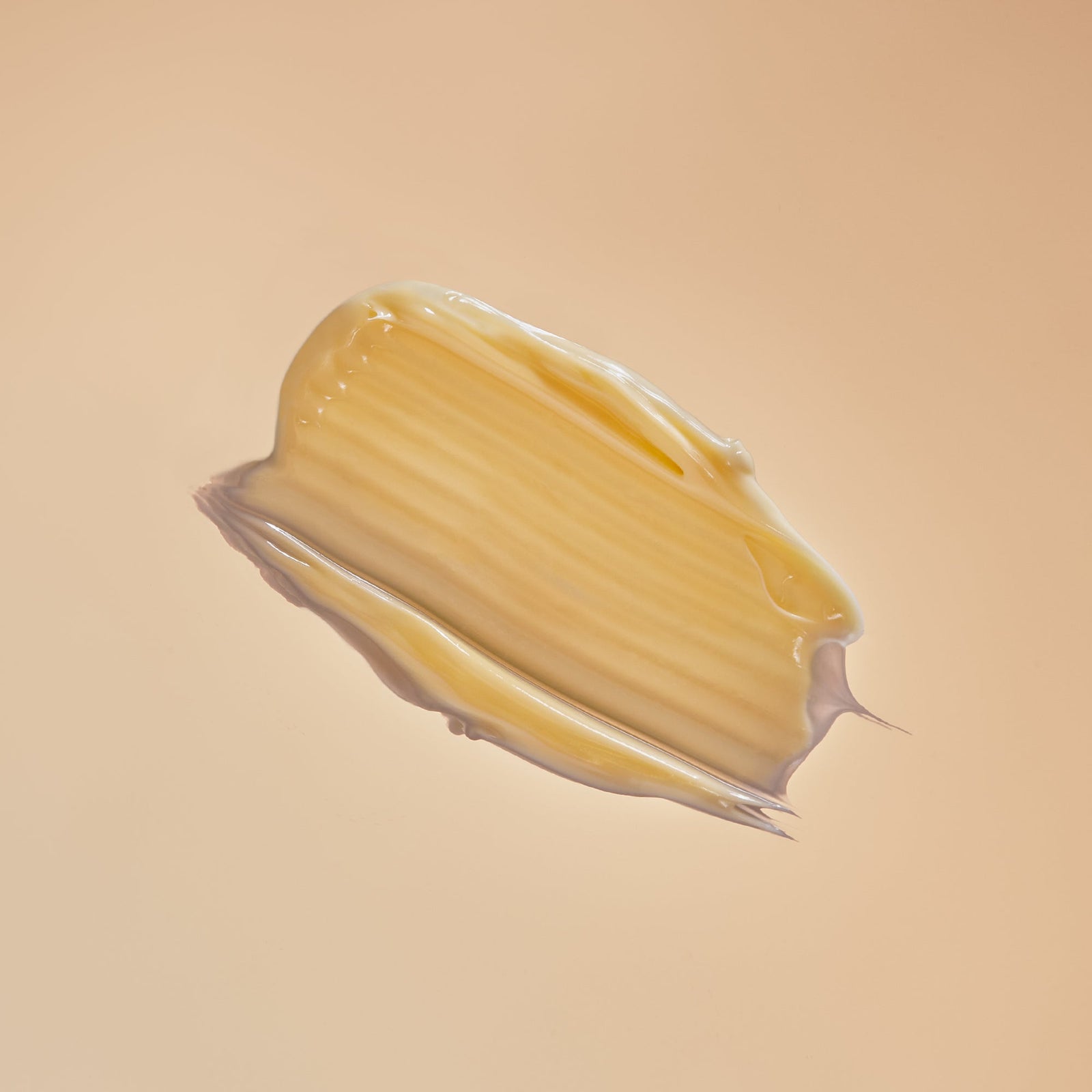 Hydrating texture of organic moisturiser from Indira Organics on a beige bright background. Shop now from VAMS Beauty.