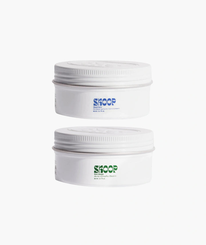 Skoop Sweat-Proof Duo featuring Hand Hero Antiperspirant Hand Cream and Skin Shield Anti-Chafe Balm in white tins. Plant-powered body care duo help reduce sweaty hands, prevent chafing, minimise thigh friction