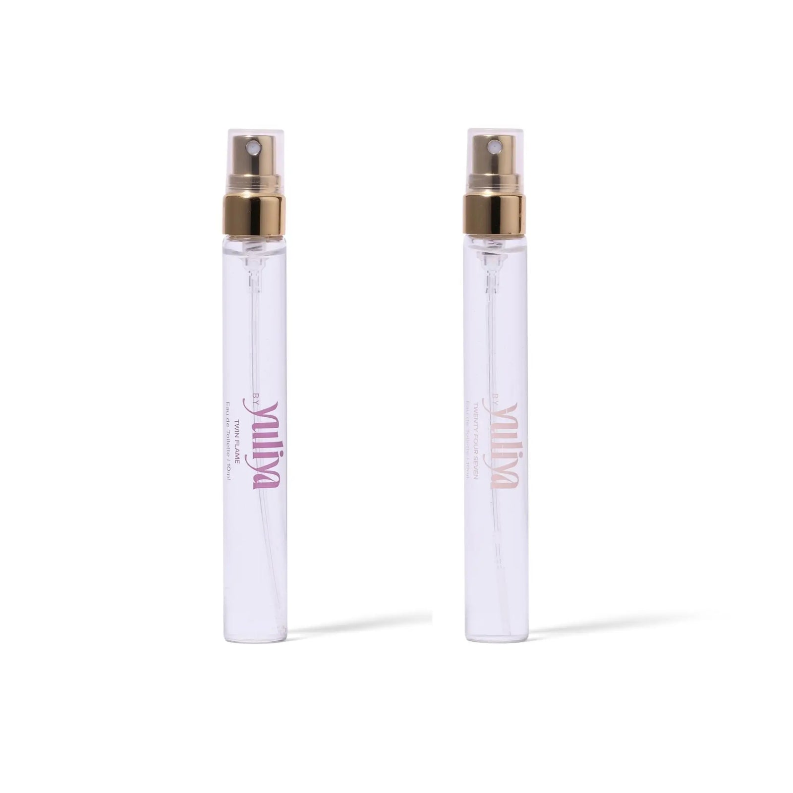 Two clear spray bottles of  travel size perfume set Australia with gold nozzles on a white background.