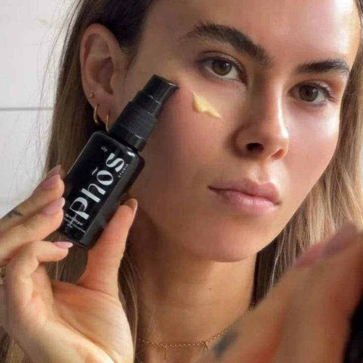 Woman applying Phōs Studio Ayurvedic Skincare from VAMS Beauty, an online beauty and skincare shop offering Australian made Ayurvedic skincare products for a radiant complexion.