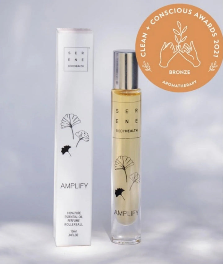 Serene Bodyhealth Amplify essential oil perfume rollerball bottle with product box and award badge.