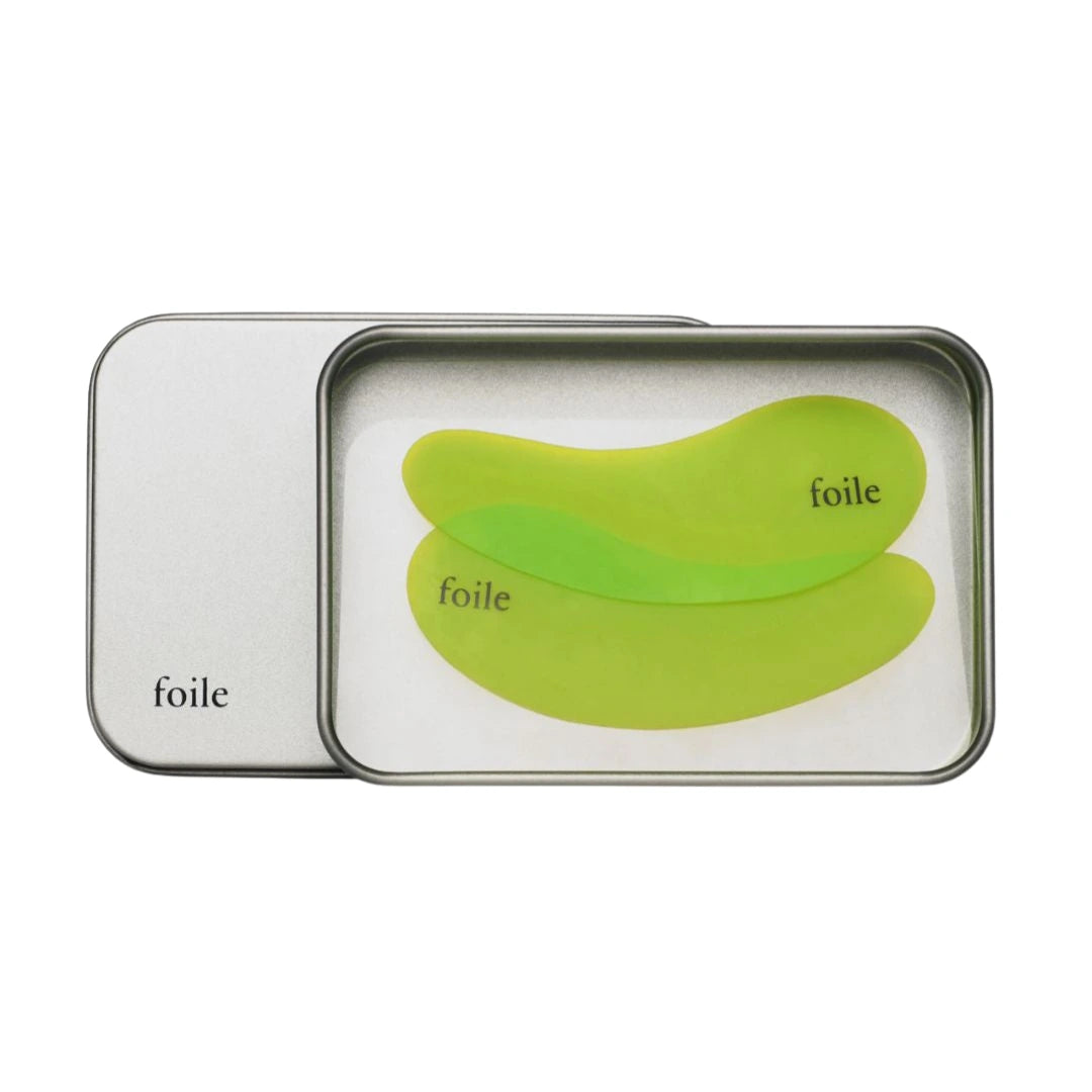 Green best reusable eye masks in a metal tin labeled 'foie' on a white background
