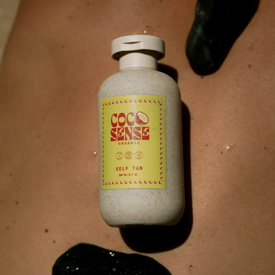 Bottle of Coco Sense best fake tan australia on a brown surface