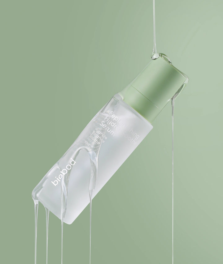 Biobod Replenishing Hydra-Soothe Serum 50ml surrounded by a translucent hydration veil, lightweight hyaluronic acid serum formulated to soothe redness, strengthen the skin barrier and deeply hydrate sensitive skin.