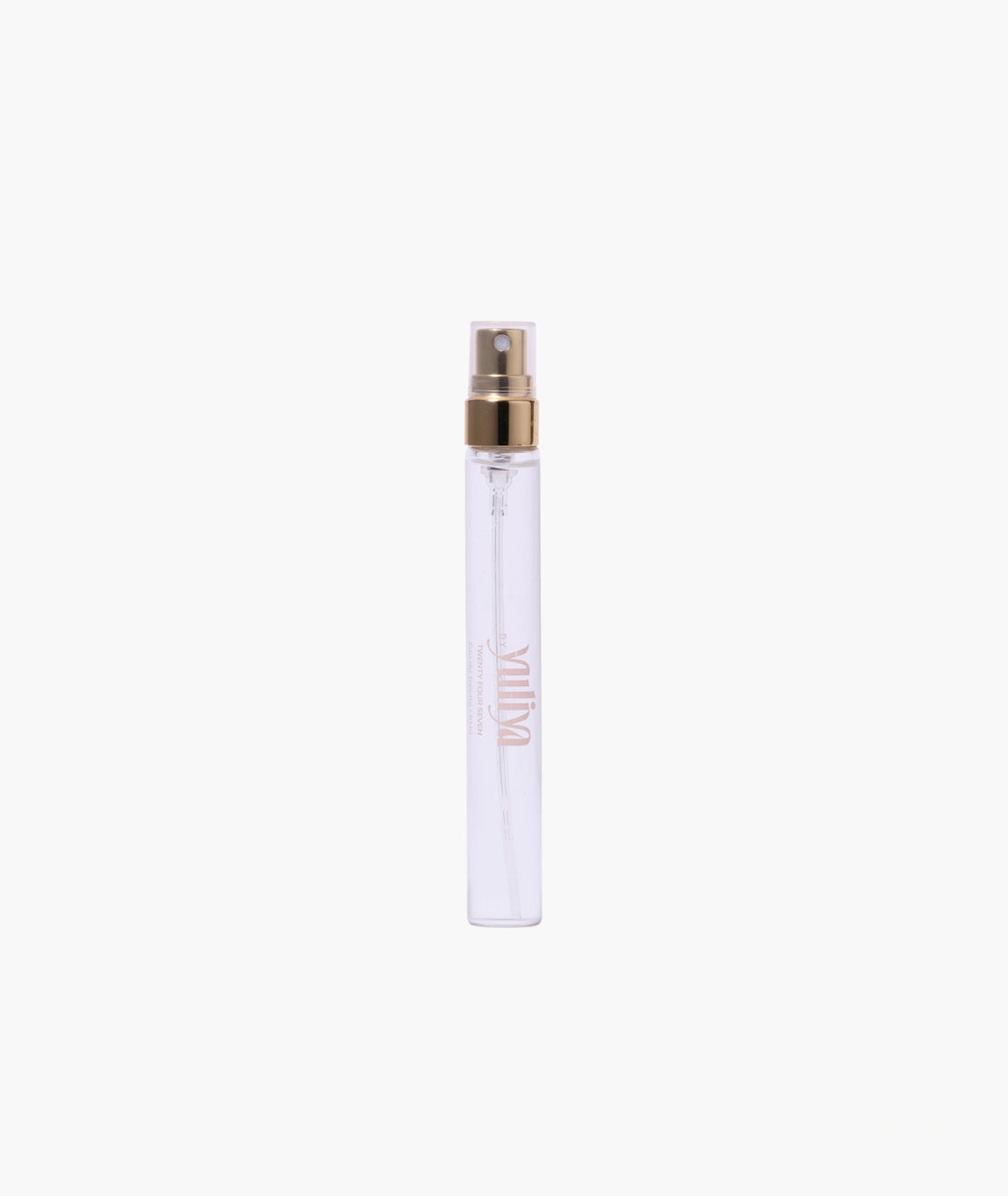Clear spray bottle with gold cap on a white background
