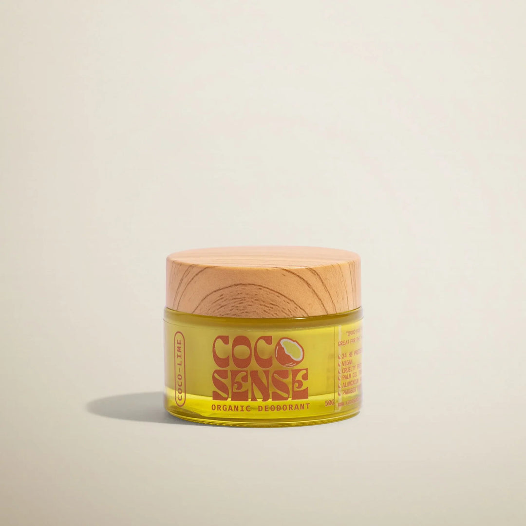 Jar of Coco Sense organic deodorant on a beige background