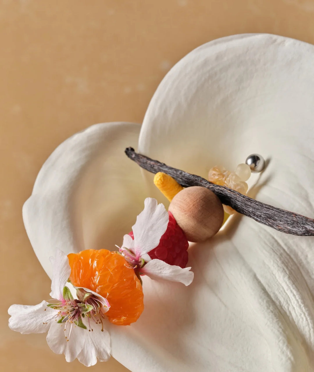 Fleurac Woodpetal Fragrance Notes — Mandarin, raspberry, vanilla pod & wood inside white lily petal