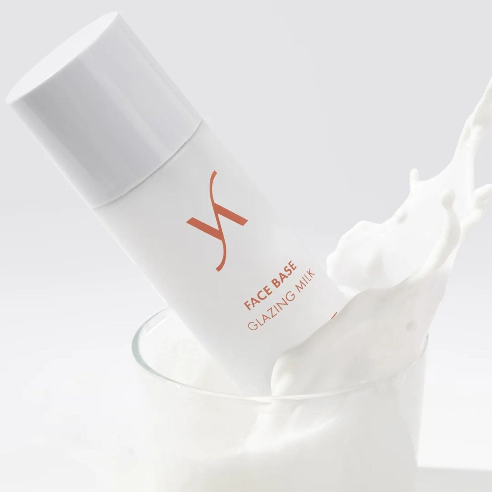 Skincare product labeled 'Face Base Glazing Milk' with a white background