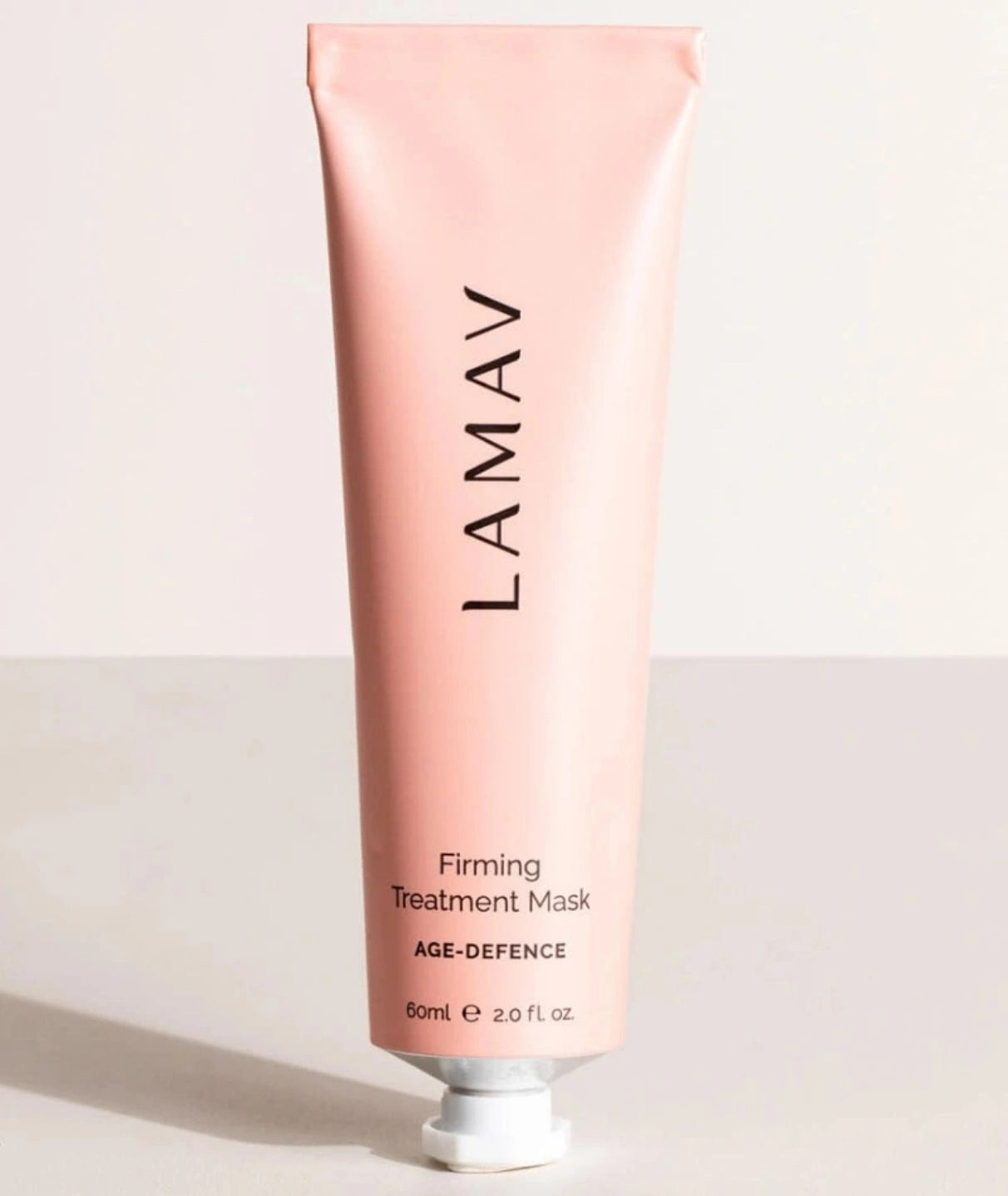 LAMAV Firming Treatment Mask standing upright on a minimalist surface. Anti-aging face mask in a pink tube.