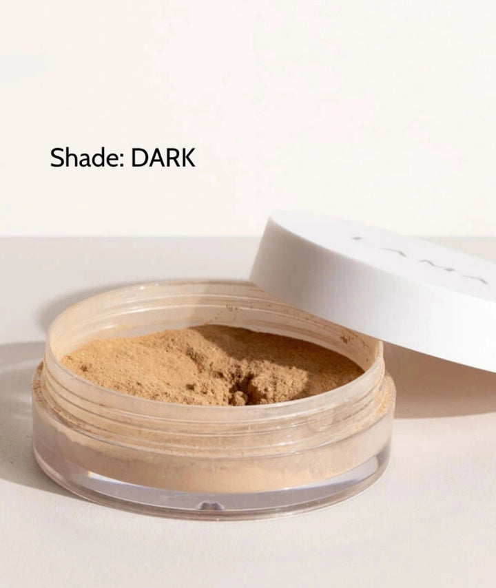 LAMAV Anti-Ageing Mineral Foundation SPF15 in Dark shade. Organic powder foundation isolated on a minimal surface.