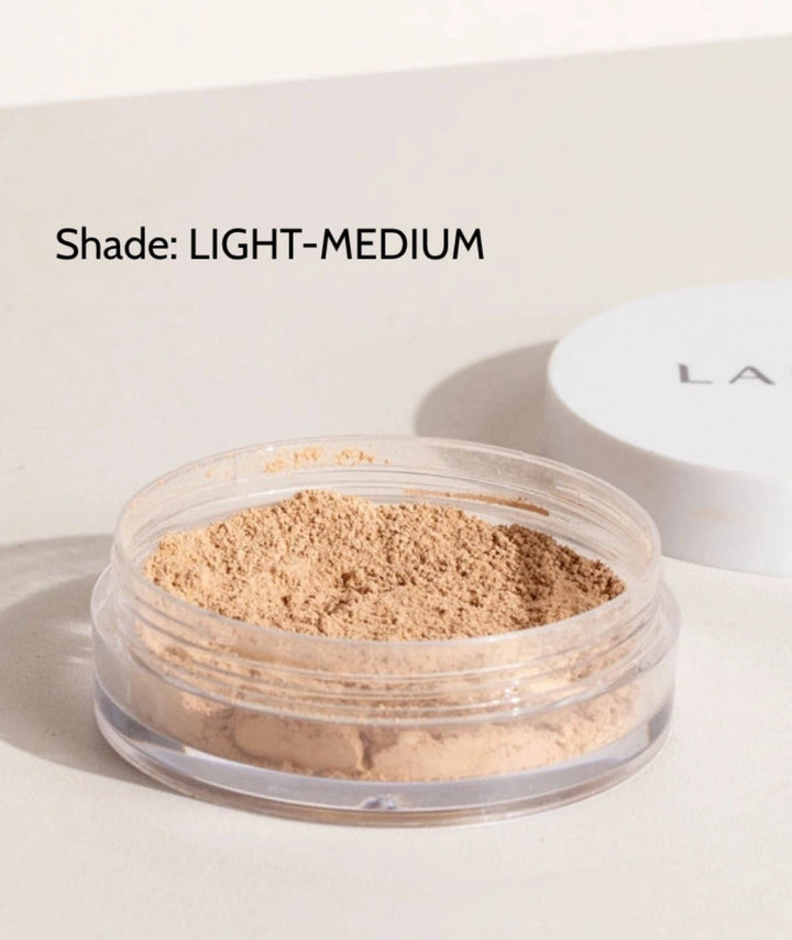 LAMAV Anti-Ageing Mineral Foundation SPF15 in Light-Medium shade. Vegan powder makeup in an open jar.