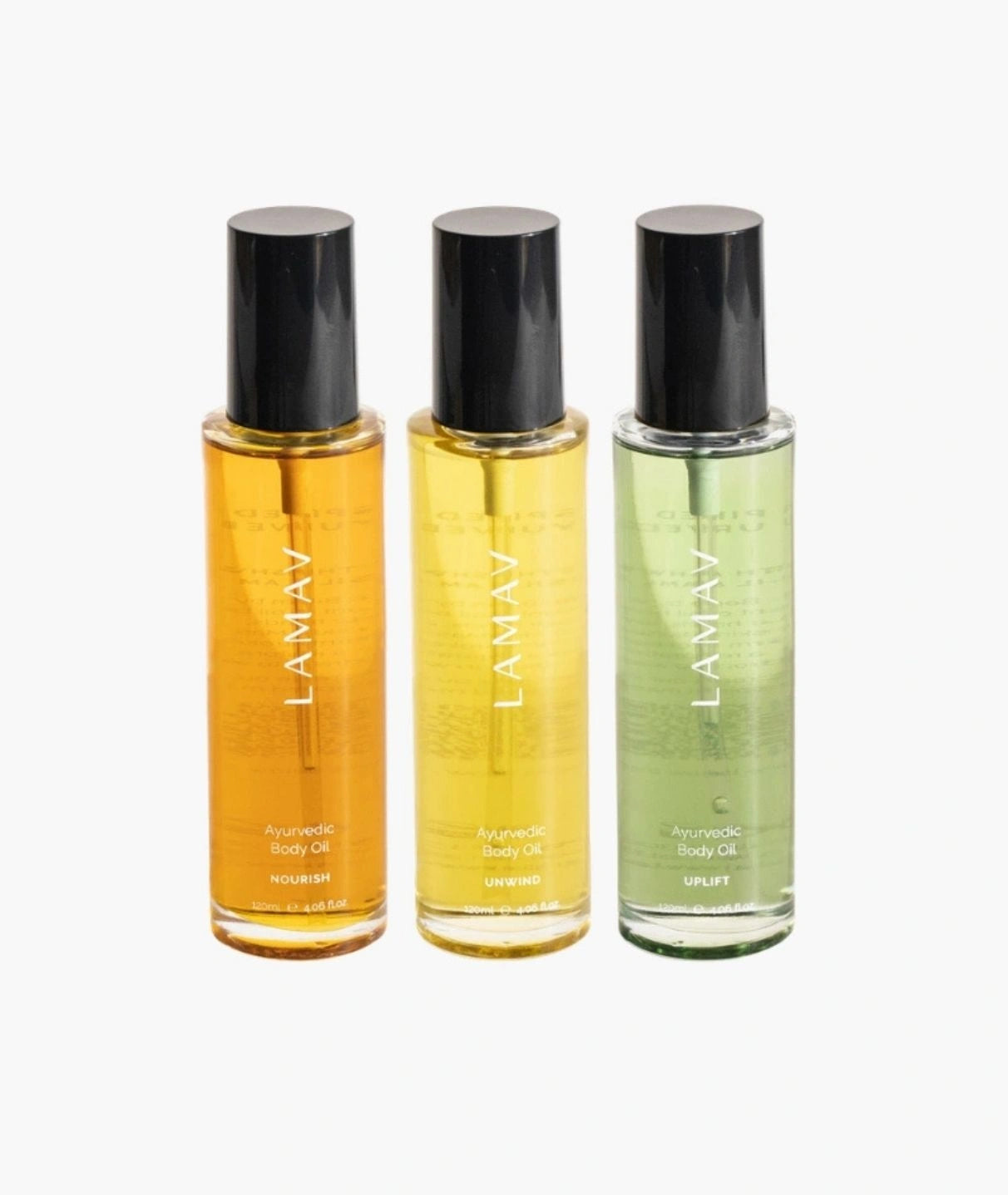 LAMAV Ayurvedic Body Oils Trio featuring Nourish, Unwind, and Uplift glass bottles.