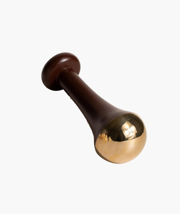 LAMAV Ayurvedic Kansa Wand isolated on a white background. Traditional Ayurvedic facial massage tool with wooden handle.