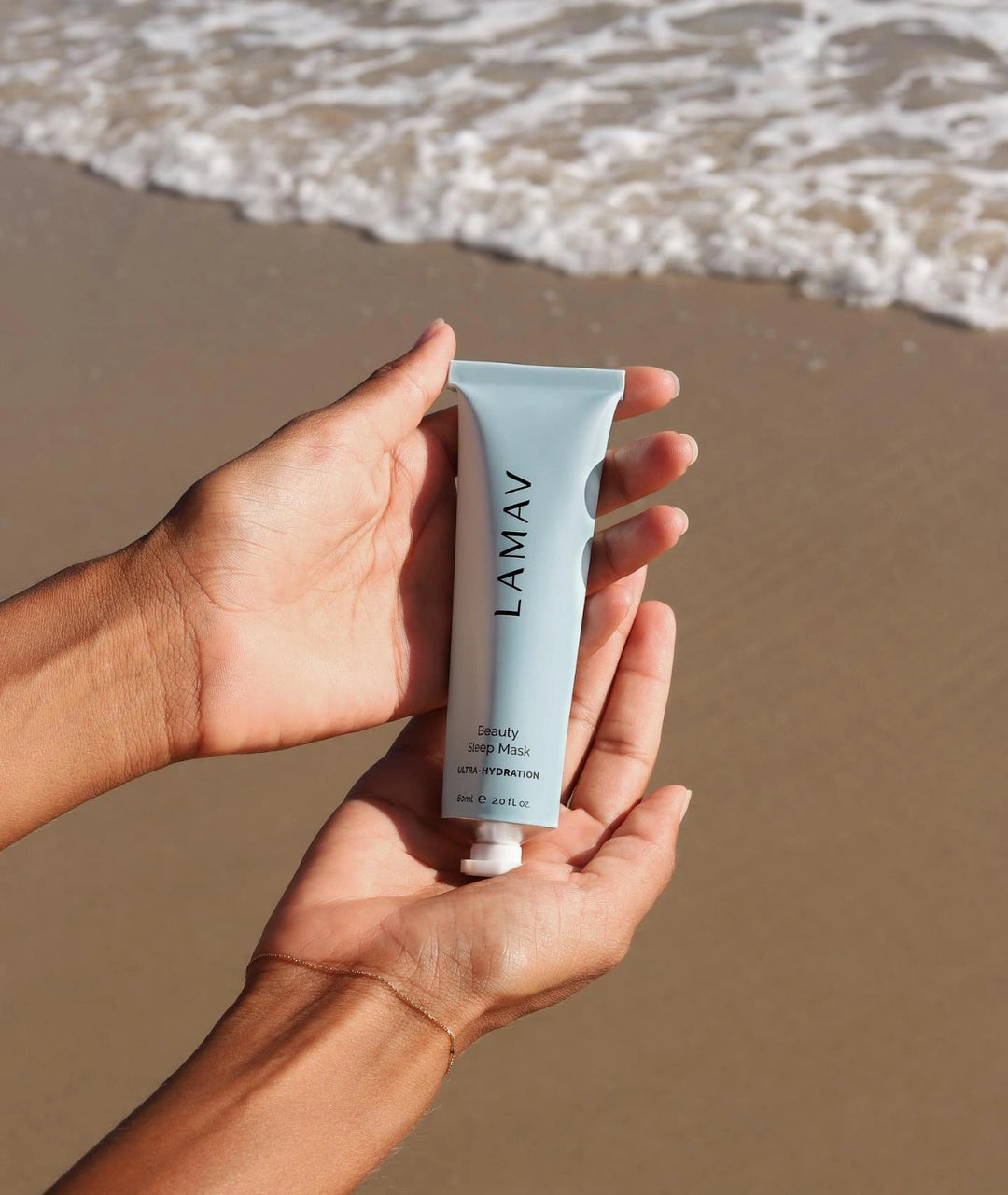 LAMAV Beauty Sleep Mask held at the beach, natural overnight hydration mask
