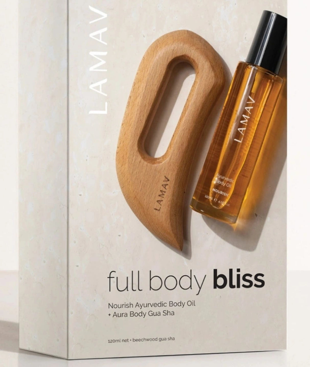 Angled view of the LAMAV Full Body Bliss kit packaging with body oil and beechwood gua sha