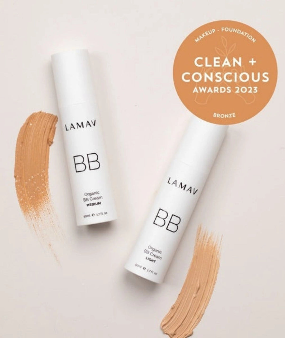 LAMAV Organic BB Cream Light and Medium bottles with swatches and a Clean + Conscious Awards Bronze badge.