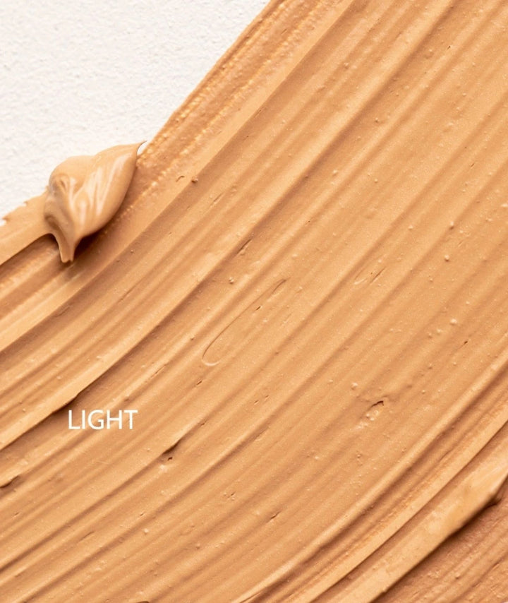 Macro texture shot of LAMAV Organic BB Cream in the shade Light showing a smooth finish.