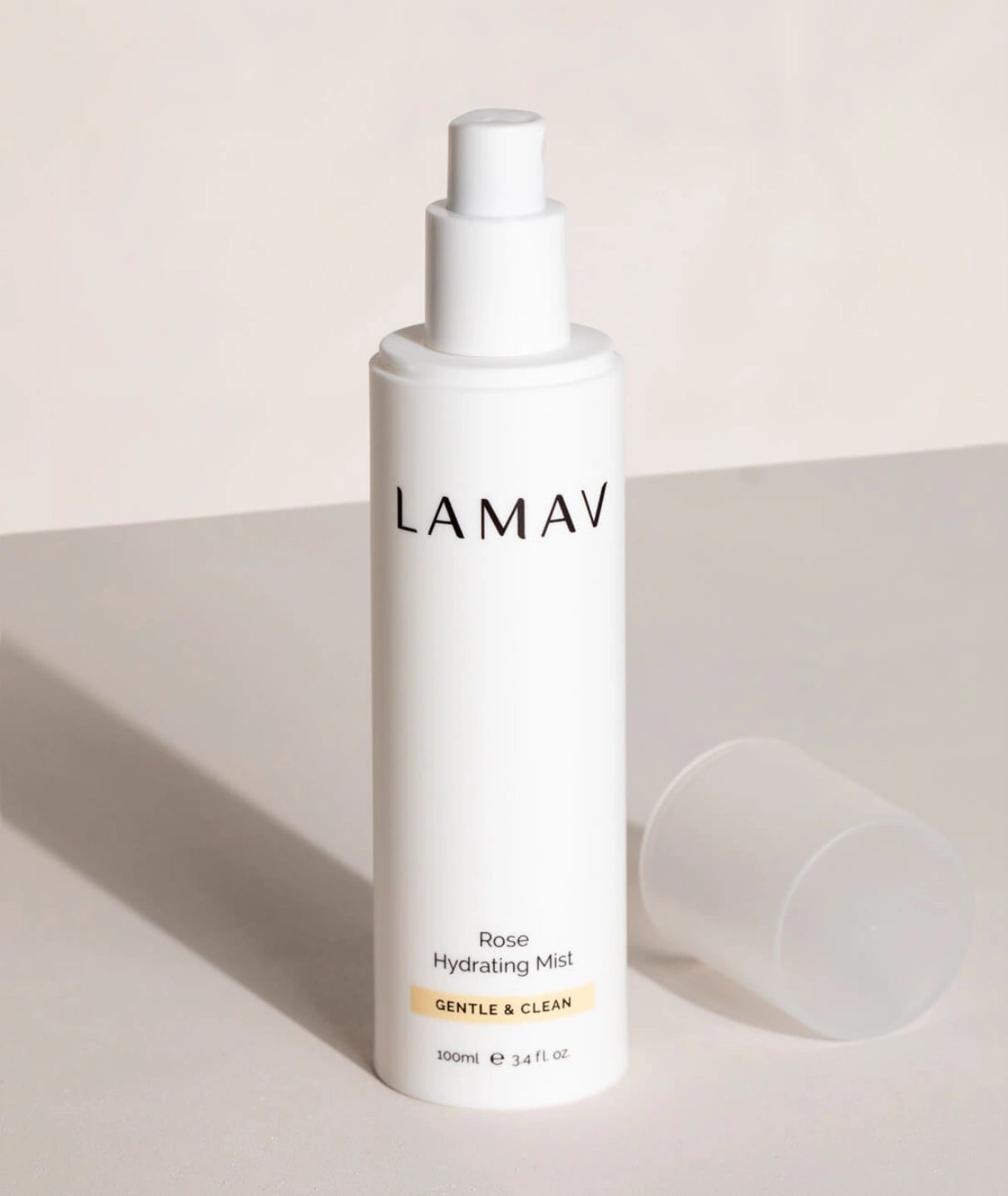 LAMAV Rose Hydrating Mist 100ml. Gentle and clean facial toner spray bottle with cap off on a minimalist surface.