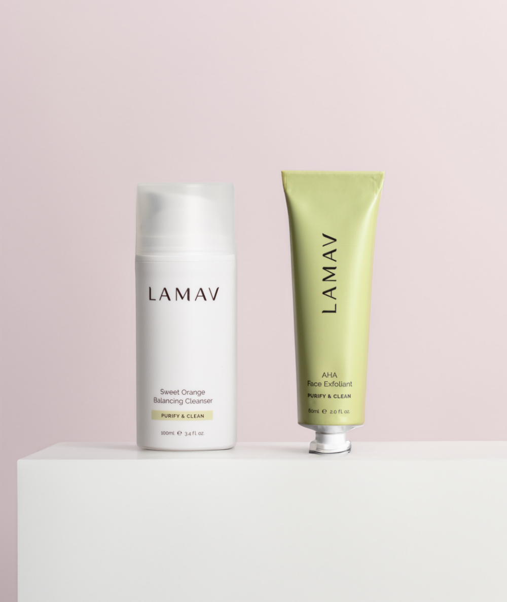 LAMAV Cleanse and Polish Pack standing on a white display block. Purifying facial cleanser and AHA exfoliant.