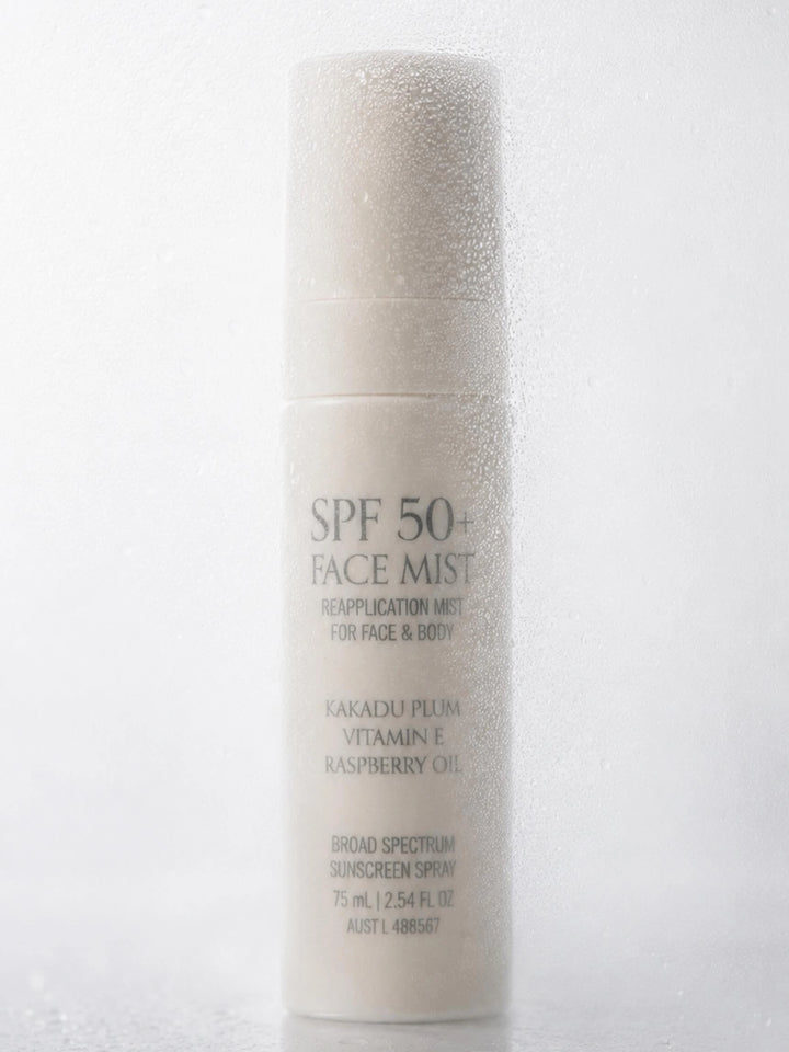SPF 50+ face mist bottle on a white background