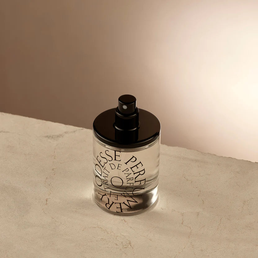 Transparent perfume bottle with black cap and stylized typography of 'ODESSE PARFUM' against a white background, evoking a sense of luxury and elegance in the design. The best Australian made perfumes, affordable natural perfumes