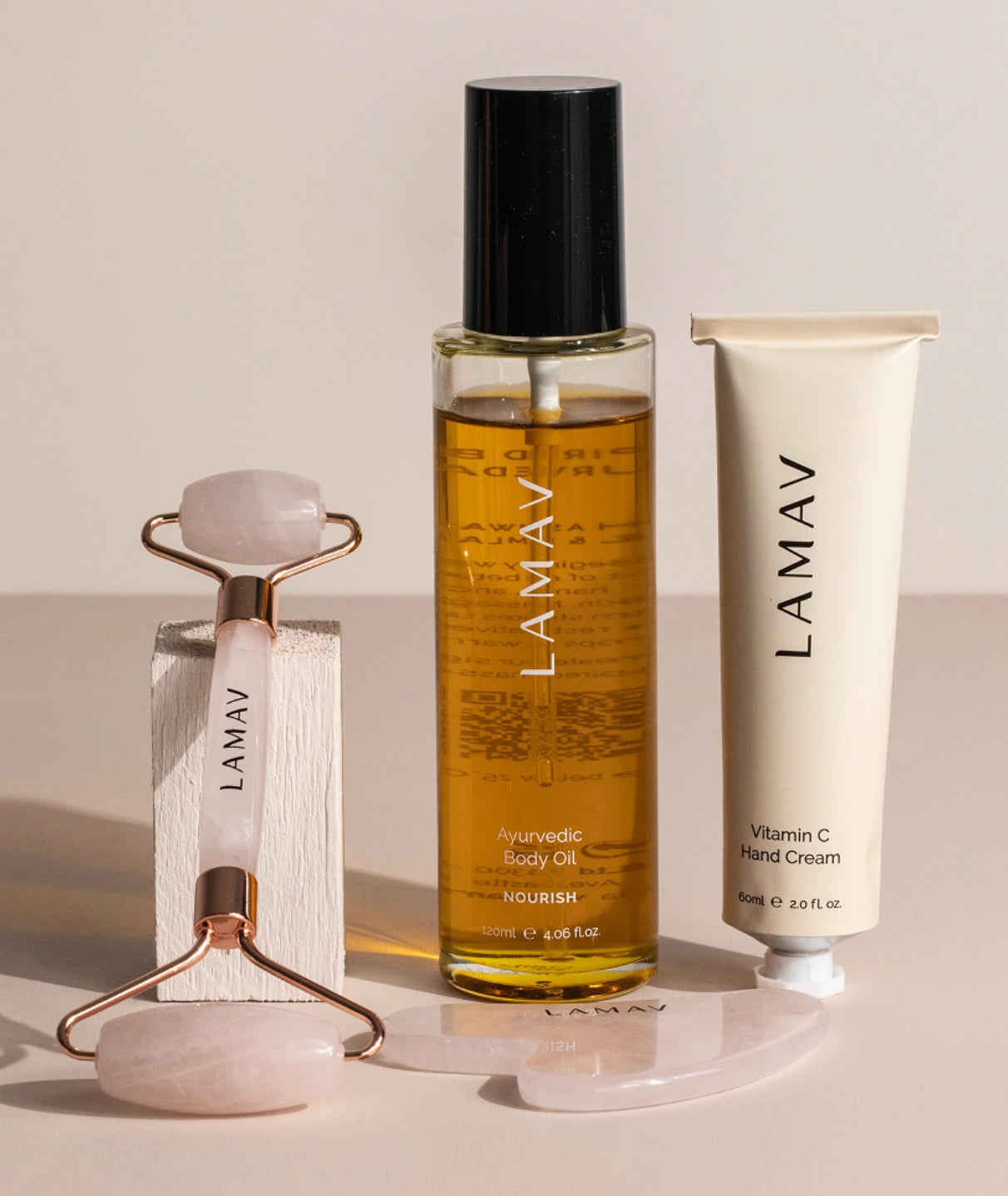 LAMAV Nourish Ayurvedic Body Oil, pink gua sha set and organic hand cream from the organic pregnancy gift set