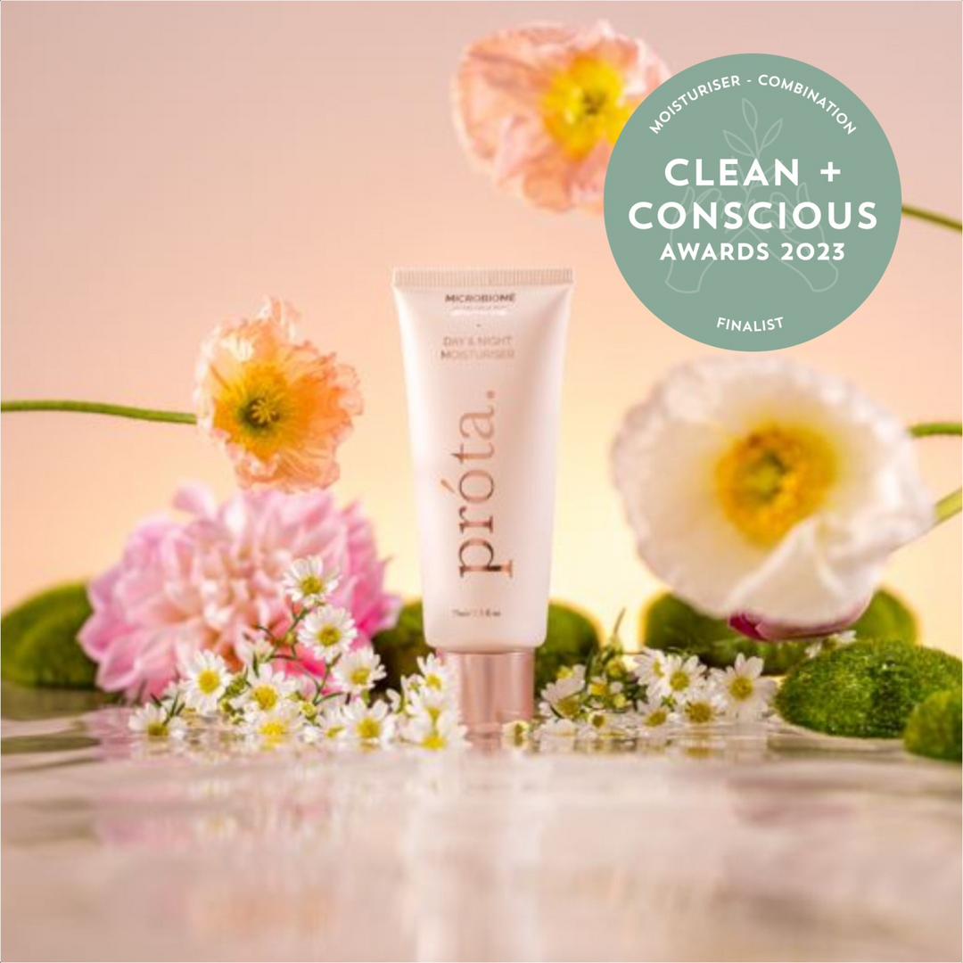 Prōta Day & Night Moisturiser with Clean + Conscious Awards 2023 finalist badge, among blossoms, highlighting eco-friendly choices in Australia.