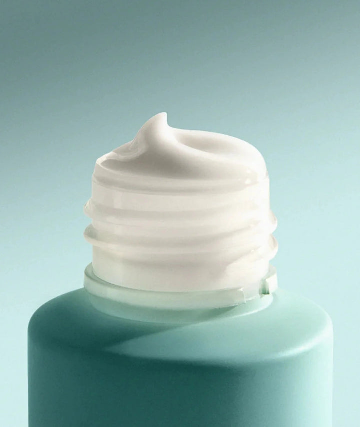 Hydrating Cream Cleanser by SAMI — rich white cream texture on bottle tip | gentle no-rinse formula