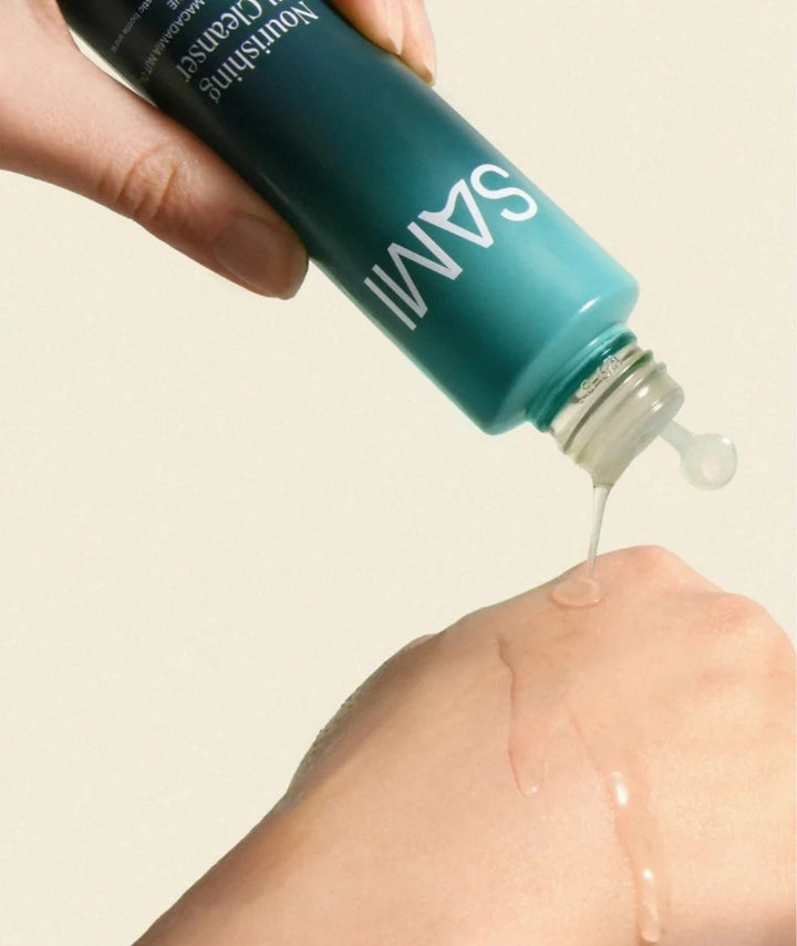 SAMI Nourishing Oil Cleanser dispensed onto hand showing smooth oil texture for makeup removal.