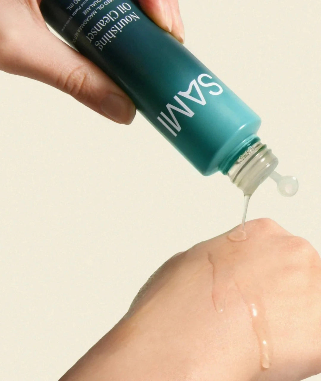 Nourishing Oil Cleanser by SAMI — pouring cleanser onto hand | dissolves makeup & hydrates skin