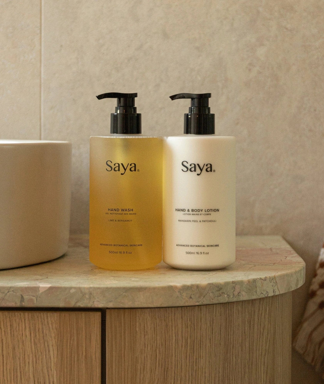 Saya Hand Wash and Hand & Body Lotion bottles resting on a bathroom vanity. Noosa botanical skincare.