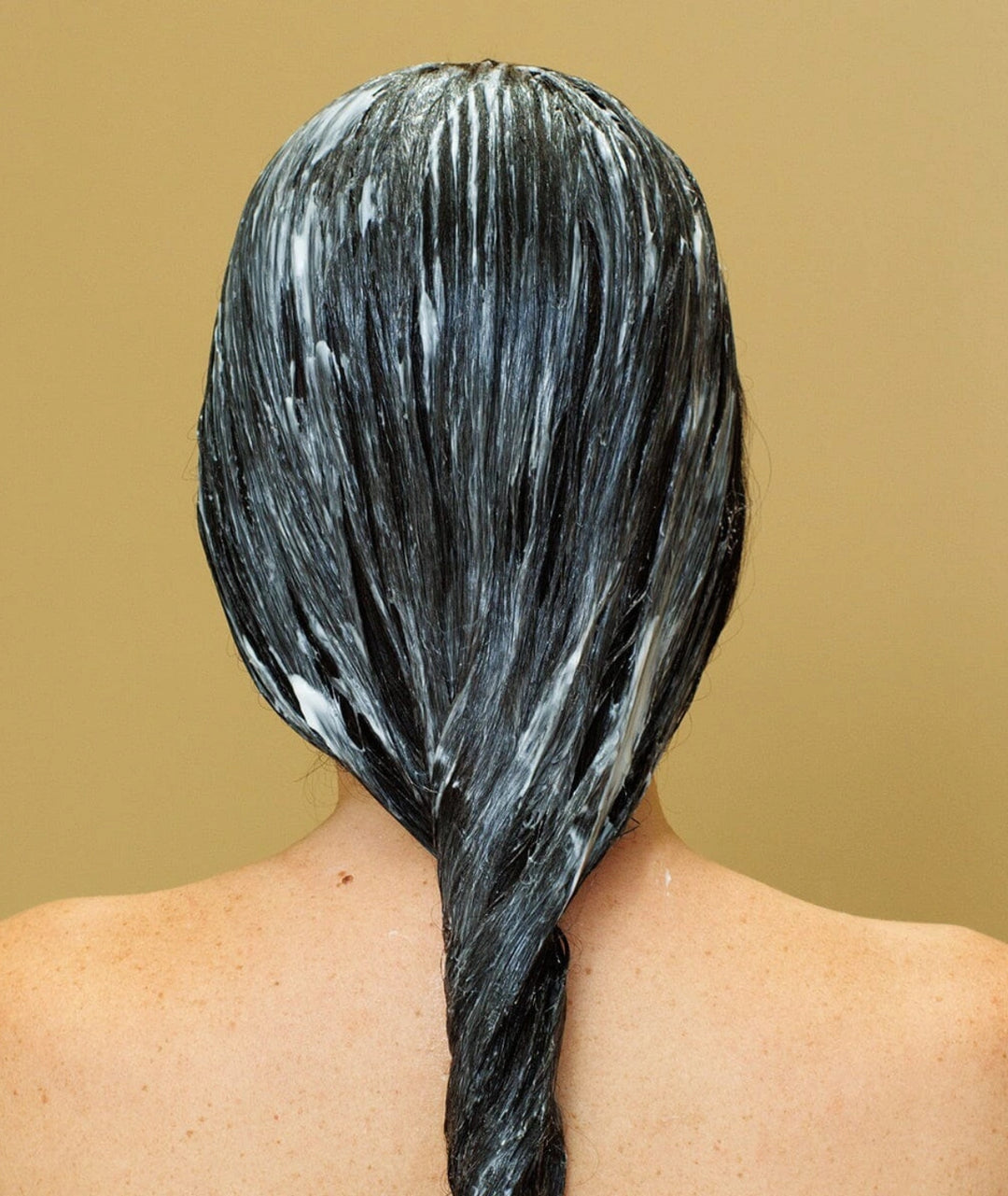 Hair coated with Saya Natural Hair Conditioner to deeply nourish, smooth frizz and hydrate dry hair.