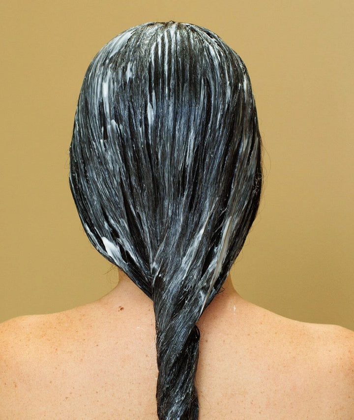 Hair coated with Saya Natural Hair Conditioner to deeply nourish, smooth frizz and hydrate dry hair.