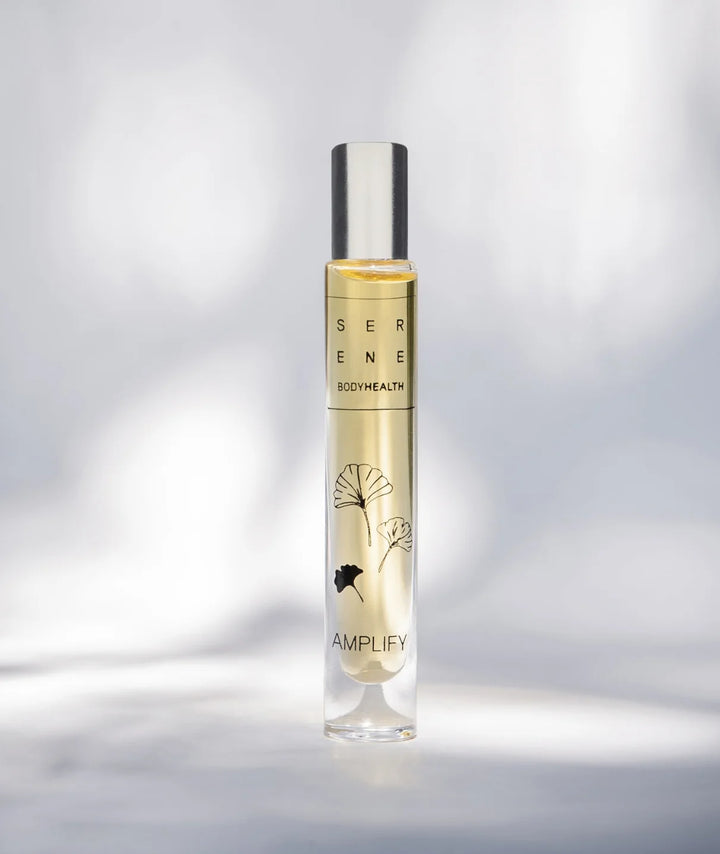 Serene Bodyhealth Amplify essential oil perfume rollerball bottle with ginkgo leaf illustration.