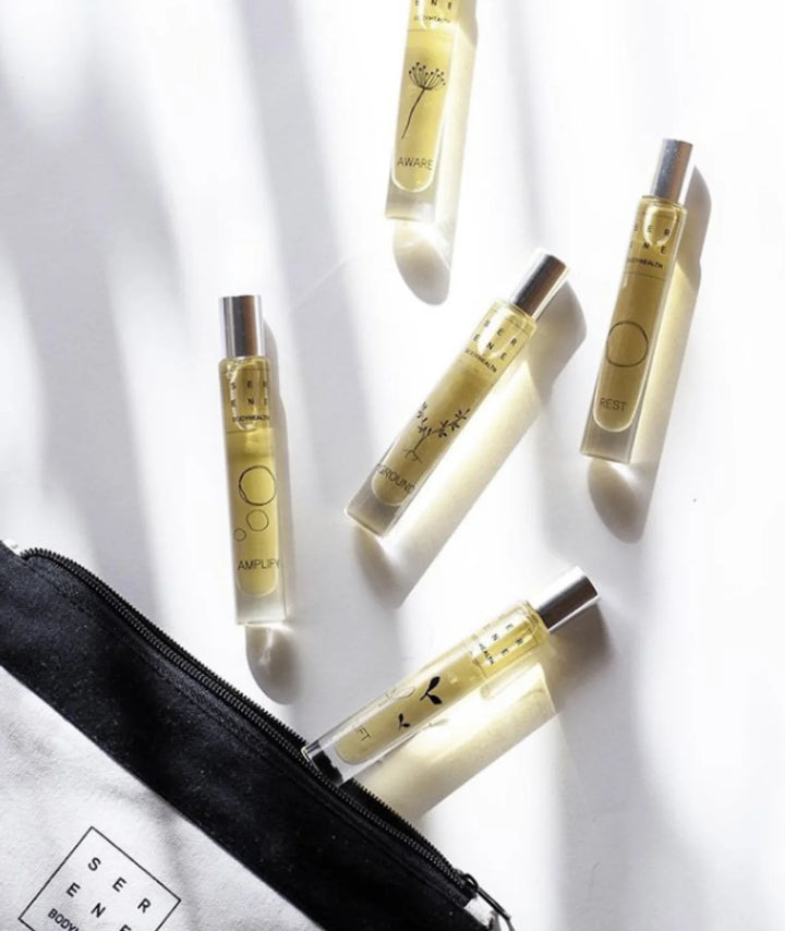 Serene Bodyhealth essential oil perfume rollerballs with branded travel pouch.