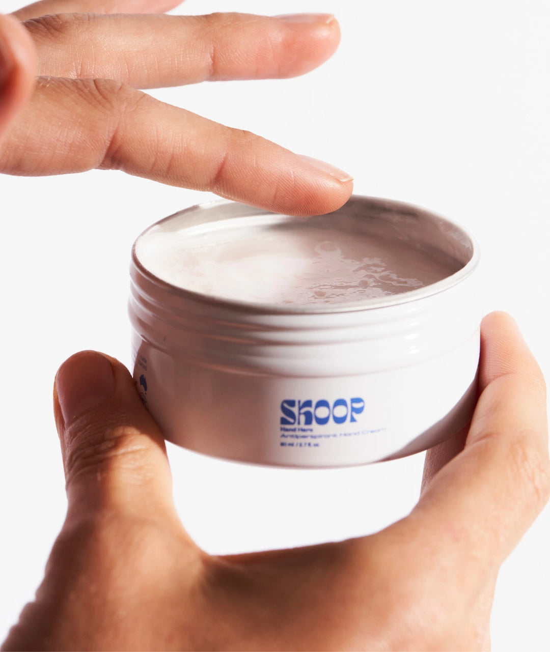 Skoop Hand Hero Antiperspirant Dry Touch Hand Cream texture in reusable tin, sweat-absorbing hand moisturiser help reduce sweaty palms while keeping hands soft. Available at VAMS Beauty Australia.