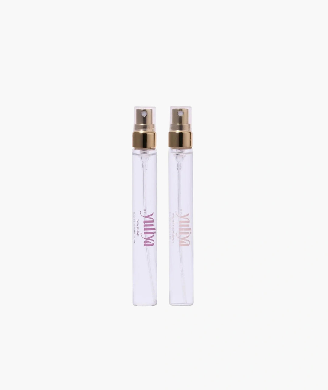 Two clear spray bottles of  travel size perfume set Australia with gold nozzles on a white background.