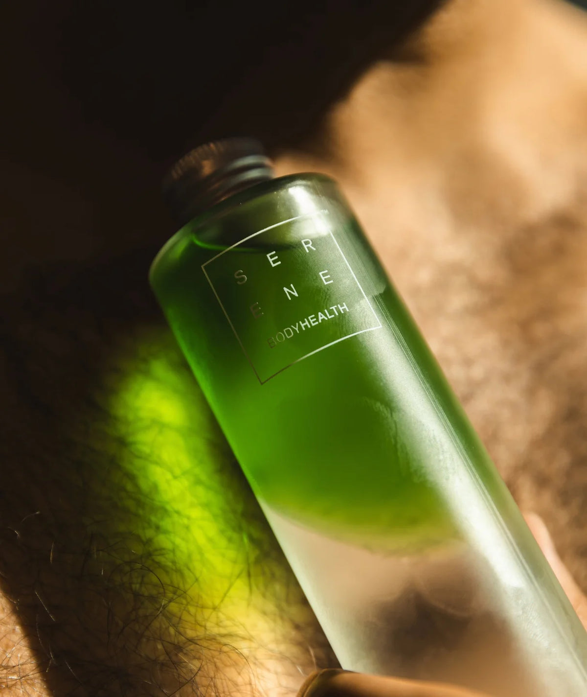 Serene Bodyhealth Zesty Gardenia magnesium body oil bottle in warm natural light.